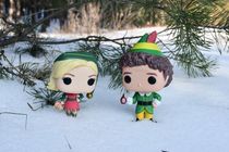 Illustrative editorial of Funko Pop action figures of Buddy and Jovie from the movie "Elf"