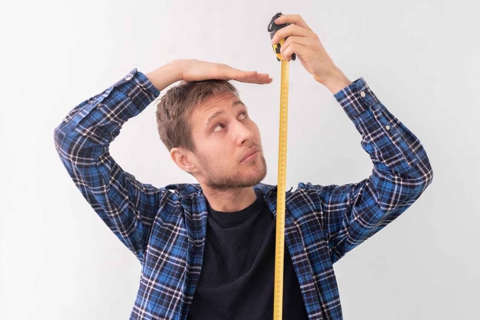 Image of a male person with a measuring tape.
