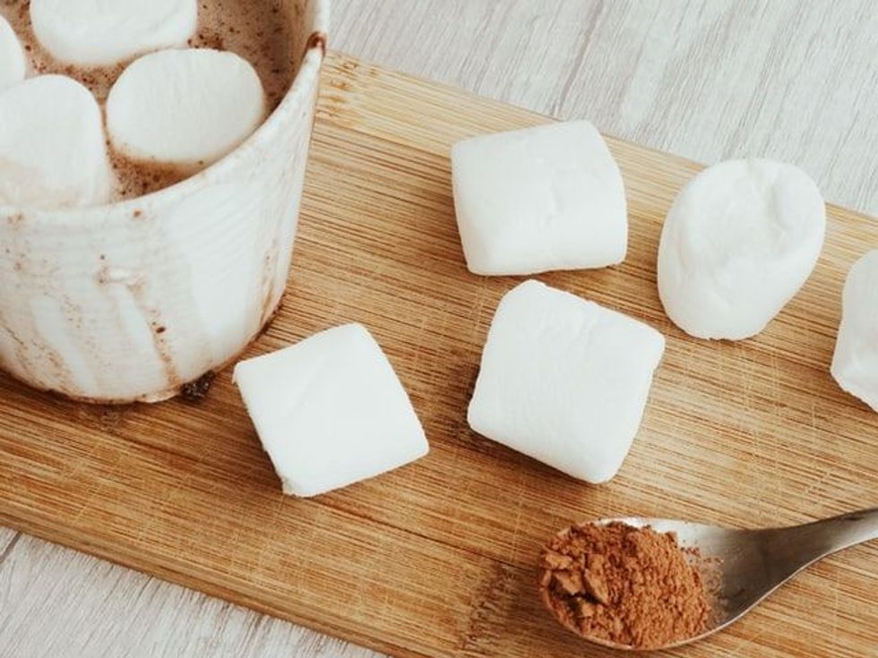 In Marshmallow facts, it is stated that marshmallows are made from mallow plants, which grow in marshes. The name of the plant was also influenced by its native environment.