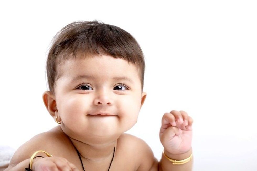 Indian baby girl playing 