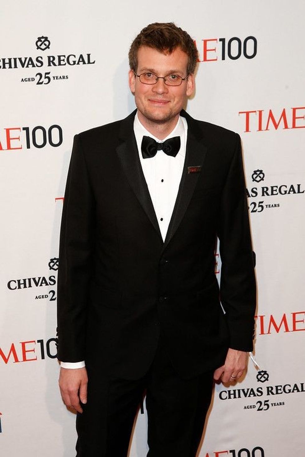 John Green in a black suit