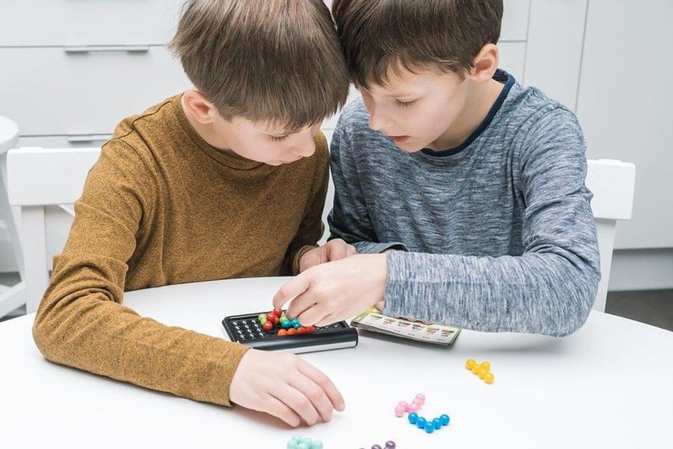 Kids playing game on phone
