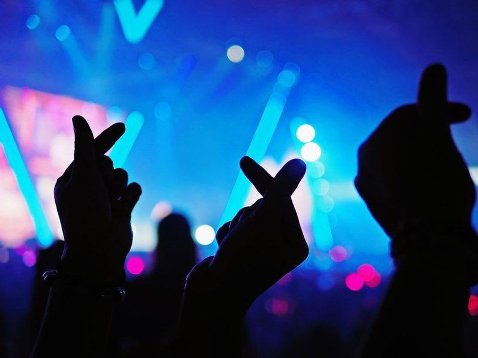 Kpop fans making sign with hands