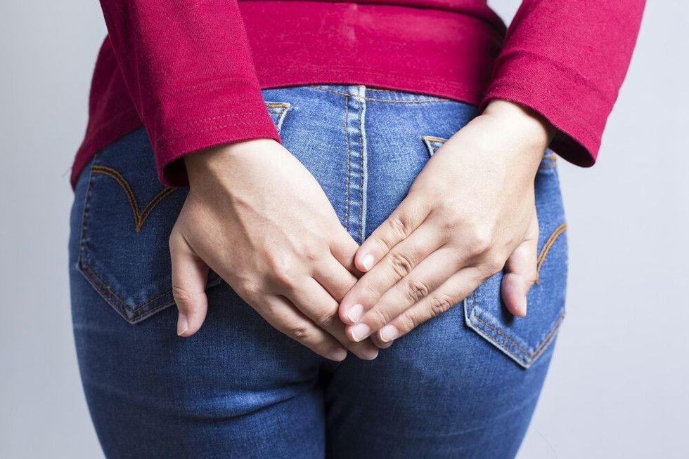 Lady placing hand behind