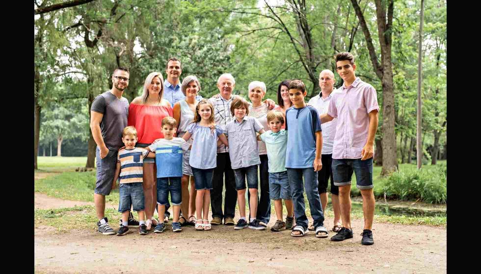 Large family with cousin grandparent father and kid in a forest
