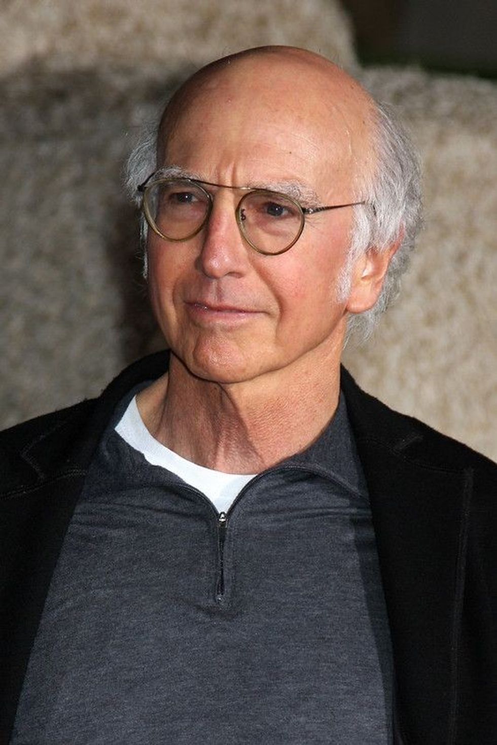 Larry David in a black coat