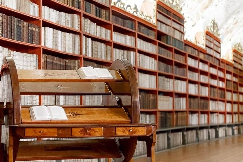 Library with multiple shelves and books. 