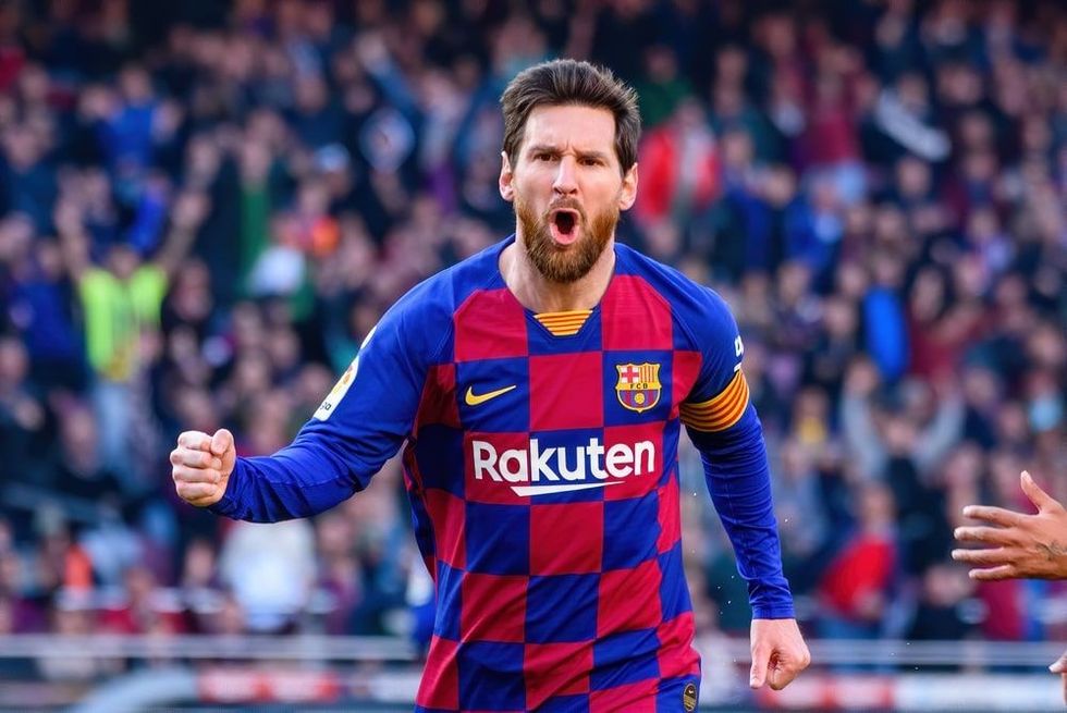  Lionel Messi celebrates a goal at the La Liga match