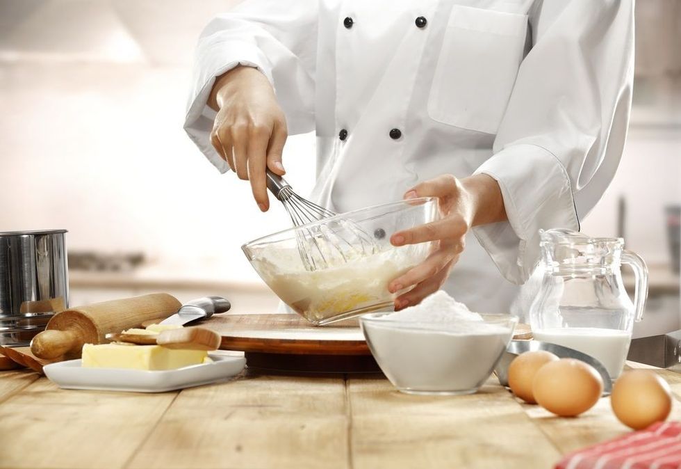 Making cake in kitchen.