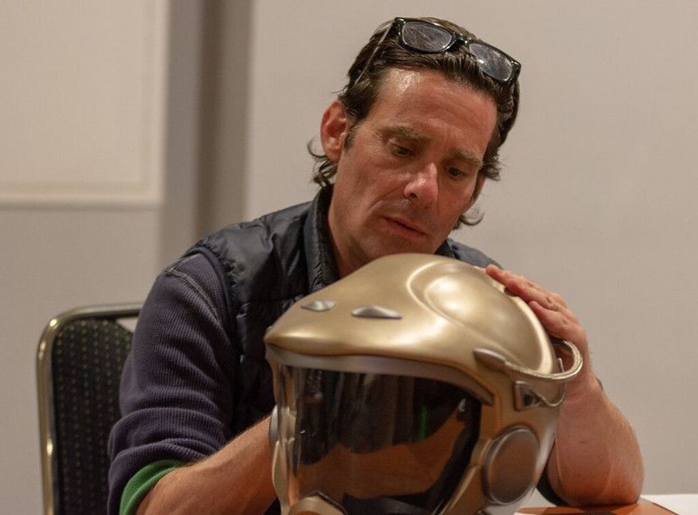 Man checking a helmet