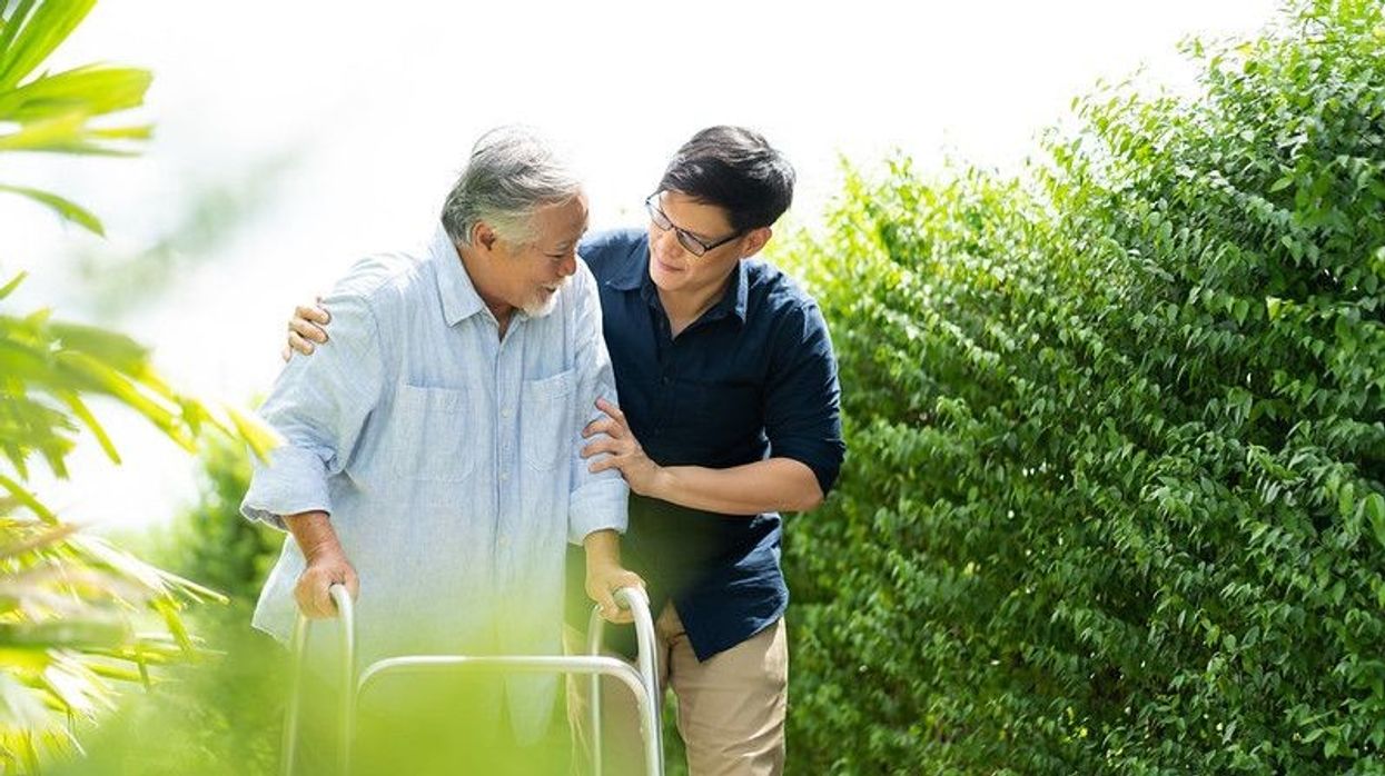 Man helping a elder person