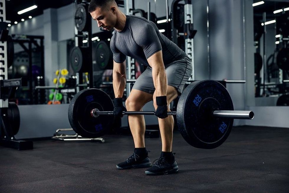 Man lifting weights in the gym
