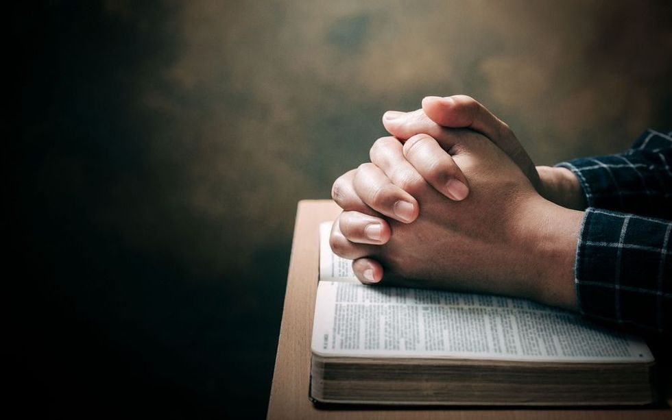 Man Pray for god blessing to wishing have a better life.