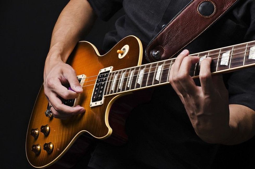 Man with guitar.