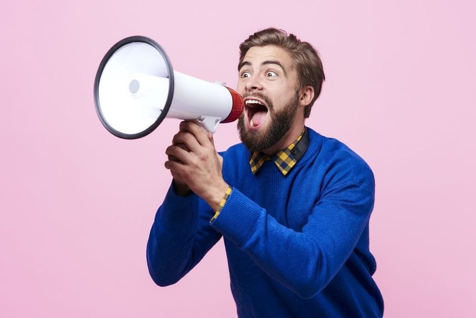 Man yelling into a megaphone