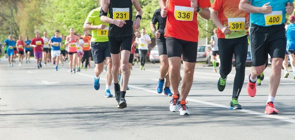 Marathon, street runners in spring day