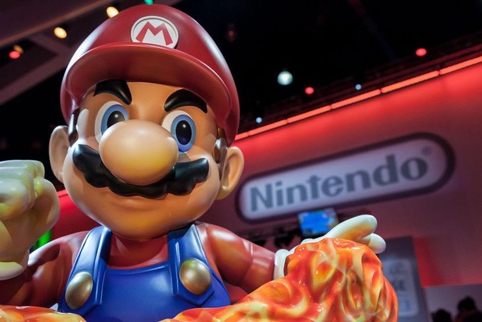 Mario statue in front of the Nintendo sign