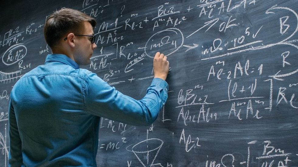 Mathematician solving a problem