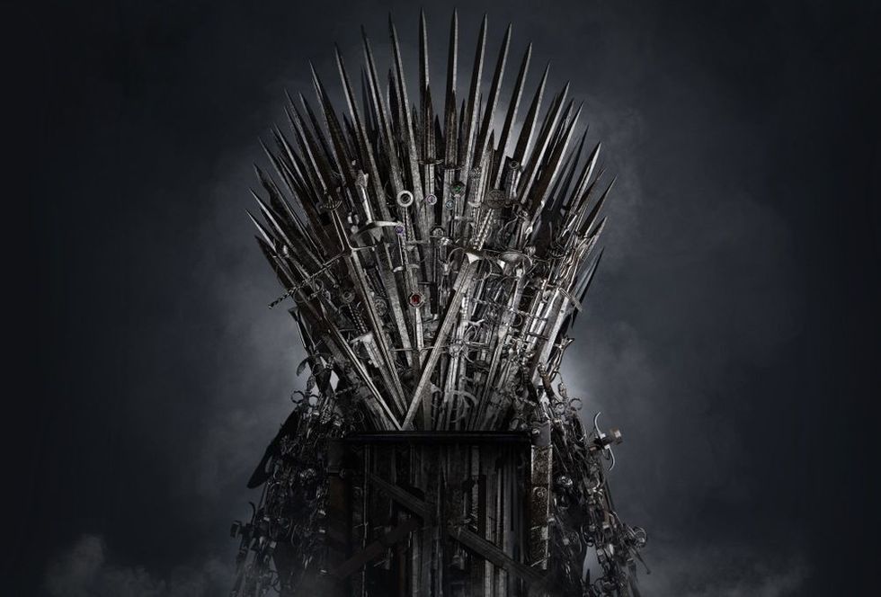 Medieval iron throne of kings made of weapons: swords, daggers, spears, knives blades. 