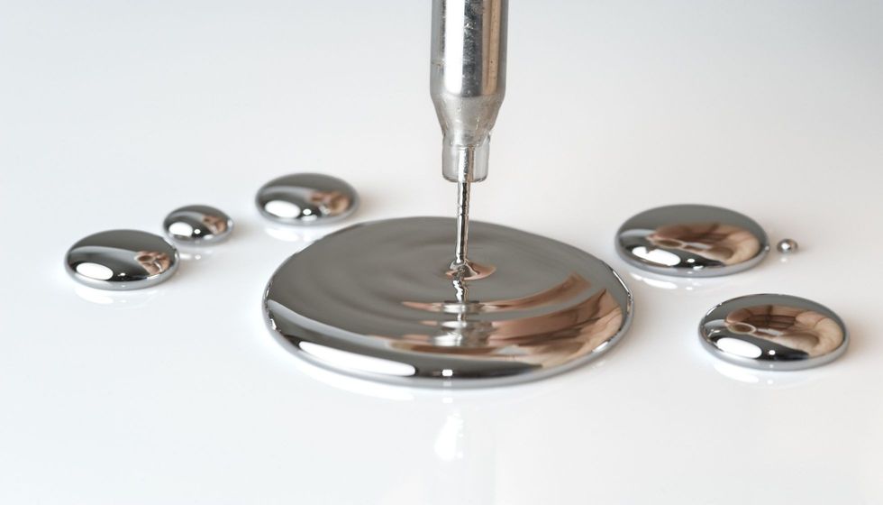 Mercury pouring from a pipette.