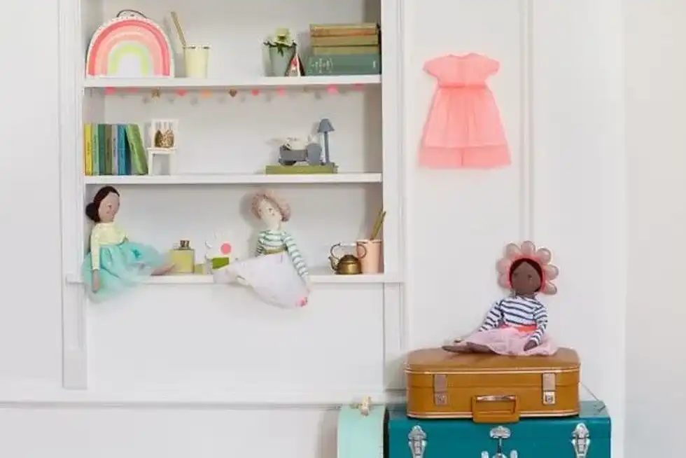 Meri Meri dolls, an example of diverse toys, sitting around in a young child's bedroom.