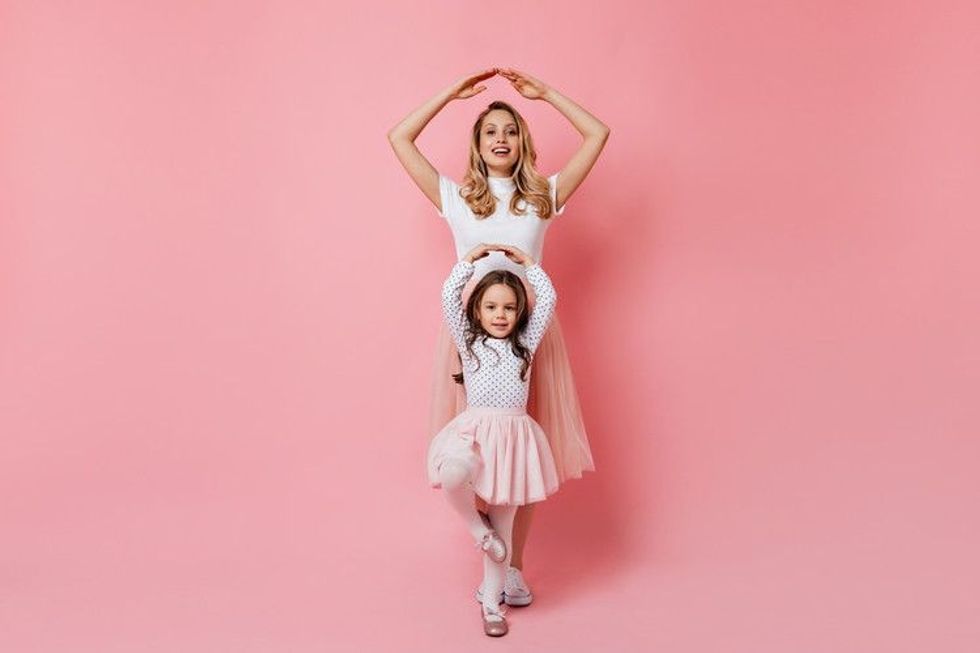 Mom and daughter in a dance pose
