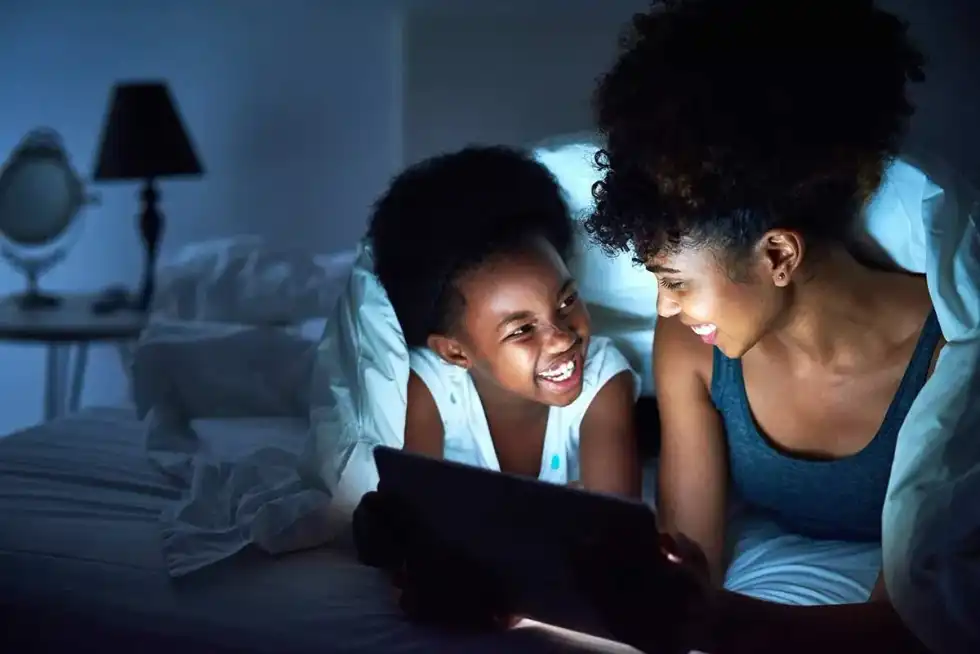 Mother and child choosing a bedtime story together.