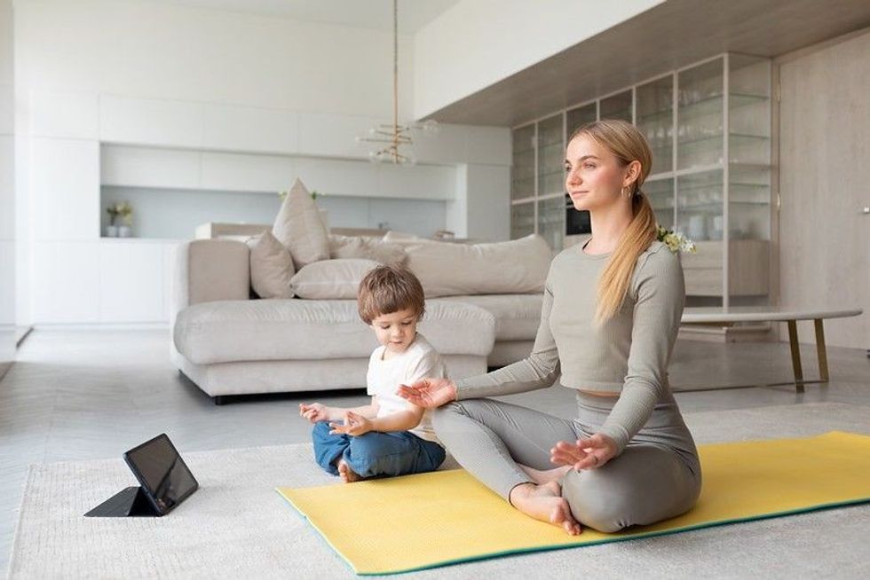 Mother and child practicing yoga