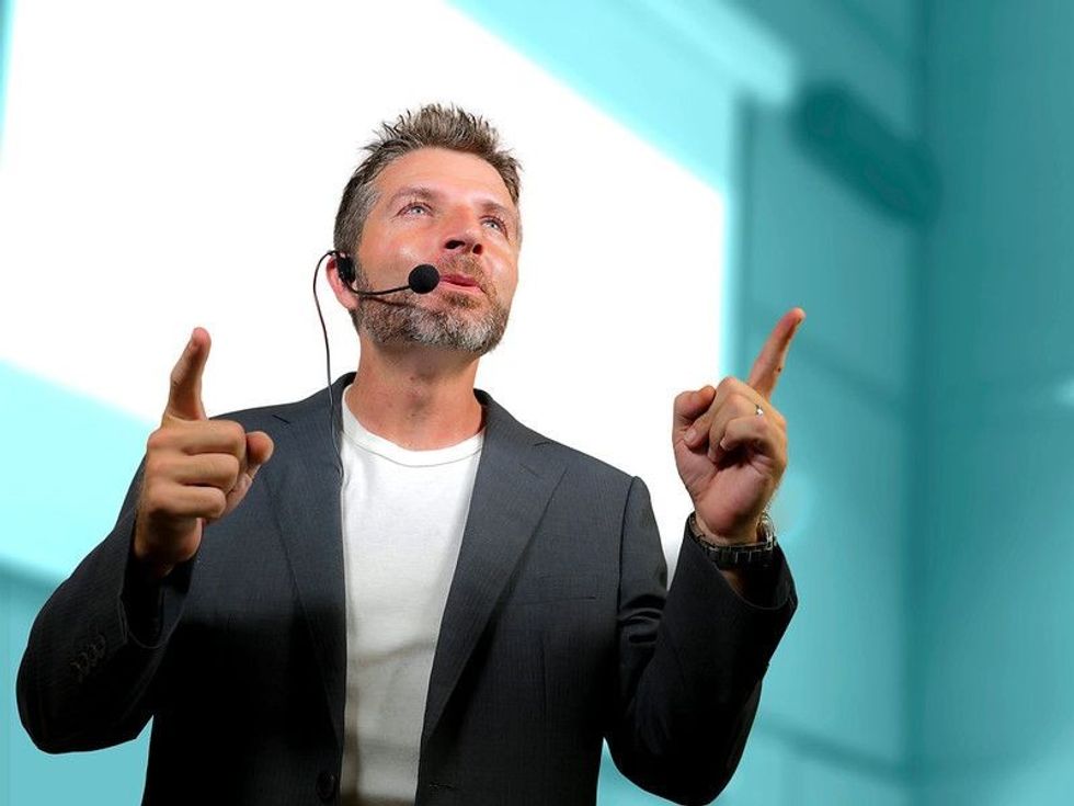 Motivational speaker motivating people to make things happen