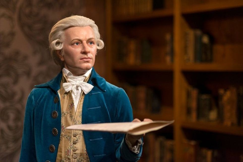 Mozart statue with sheet music in hand