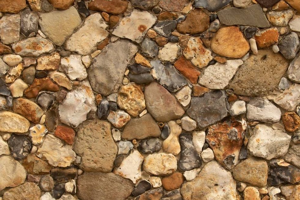 Multi color Stone wall texture with different rock types.