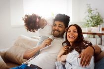 Multi racial Family of three enjoying family time at home