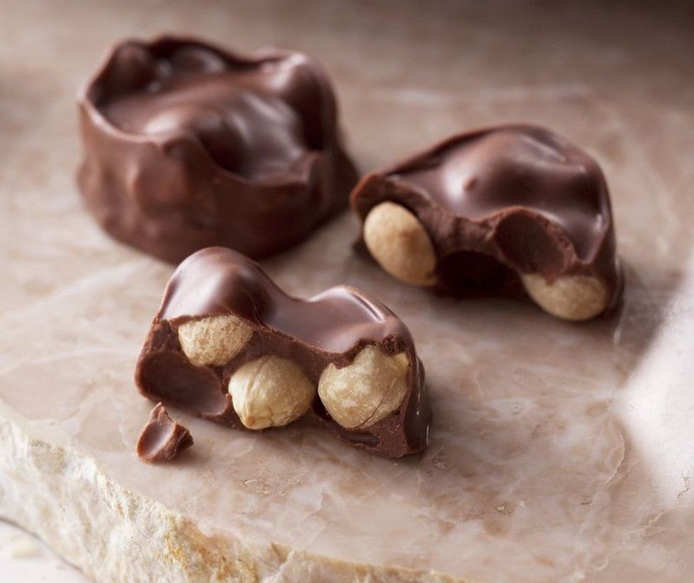 National Chocolate Covered Nut Day can be celebrated by eating chocolate popcorn and almonds.