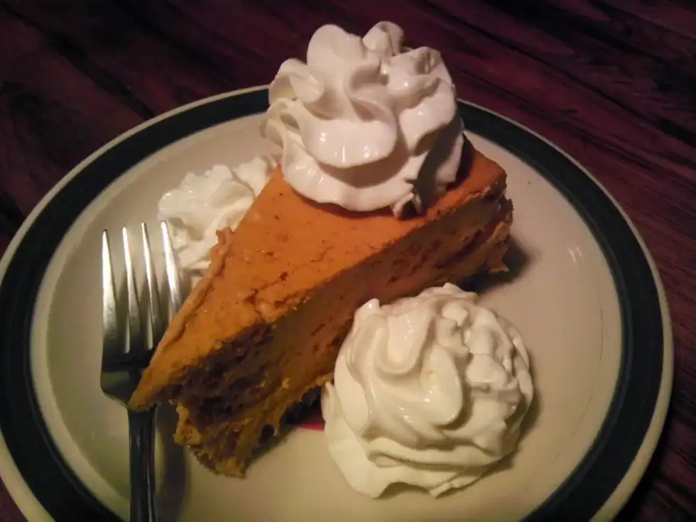 National Pumpkin Cheesecake Day is celebrated by enjoying a delicious slice of this pumpkin pie.