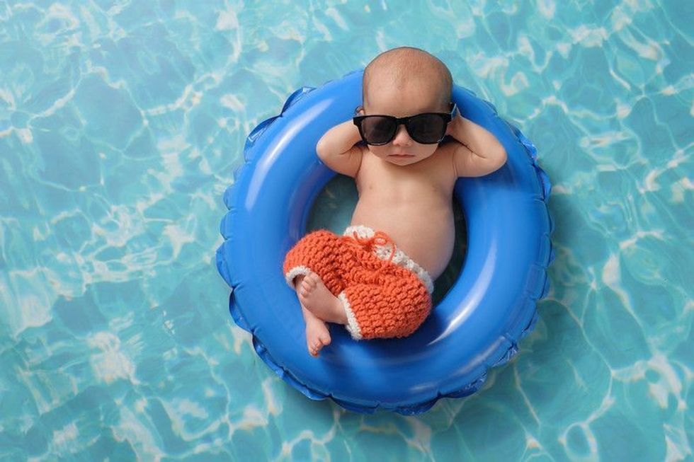 New born baby boy sleeping on a tiny inflatable swim ring - Nicknames