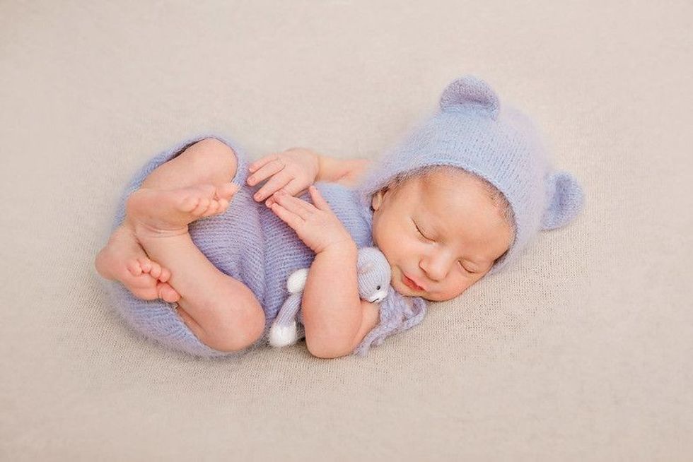 Newborn baby dressed as a gray mouse asleep with knitted mouse toy - Nicknames
