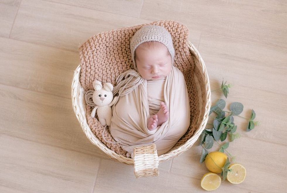 Newborn baby girl Katelyn sleeping in a basket - Nicknames