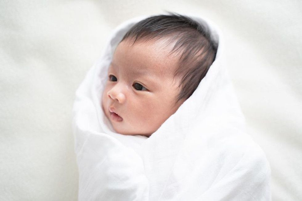 Newborn baby in white blanket - Nicknames