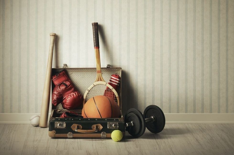 Old Suitcase with sports equipment