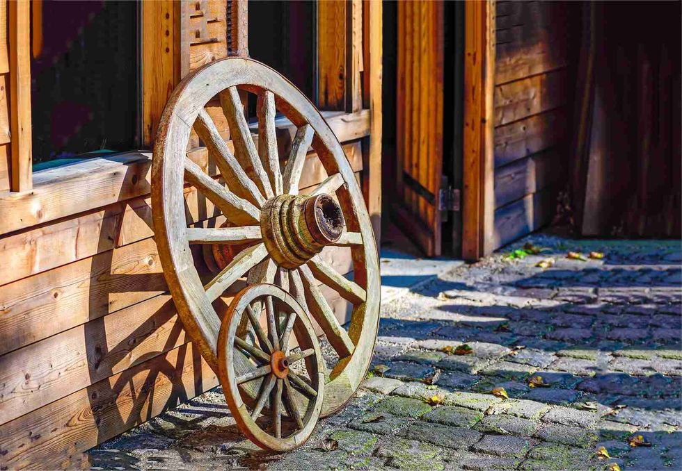 Old wooden wagon wheel.