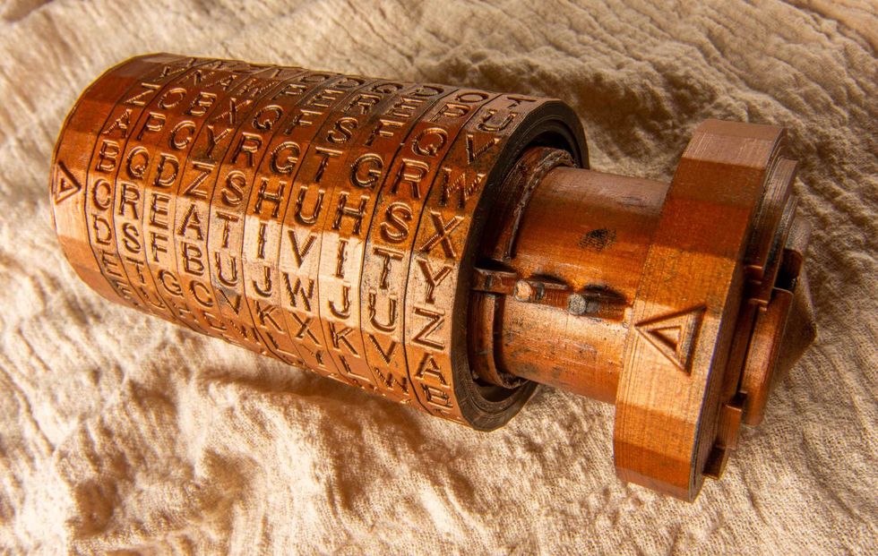 Opened brass cryptex invented by Leonardo da Vinci