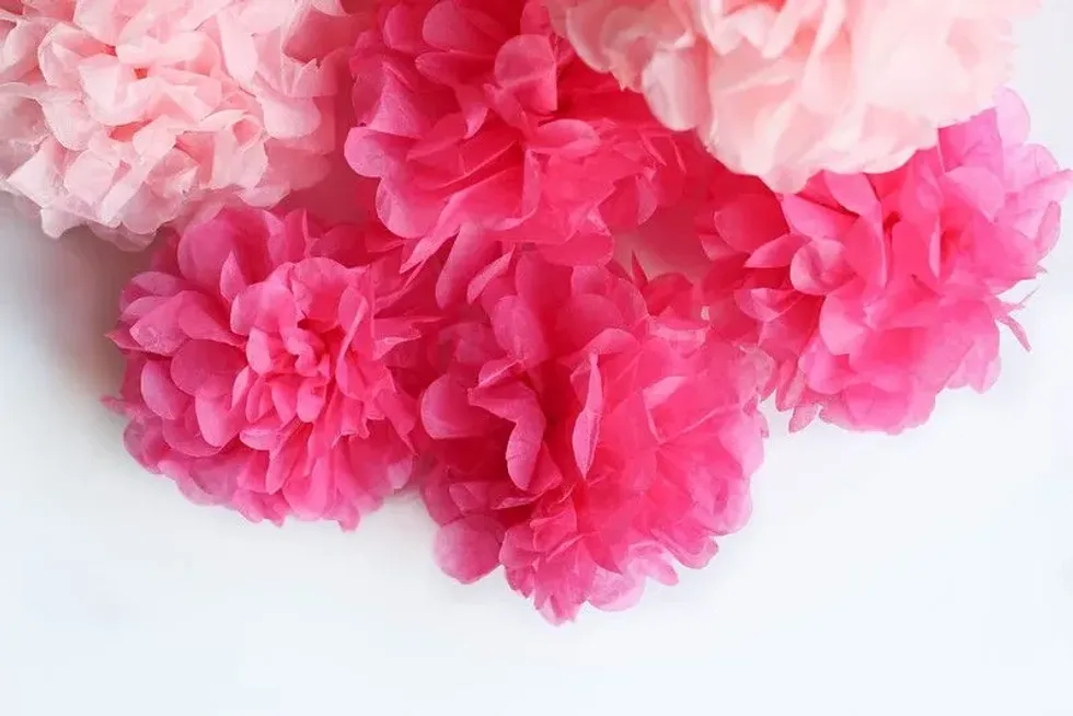 Paper flowers in shades of pink.