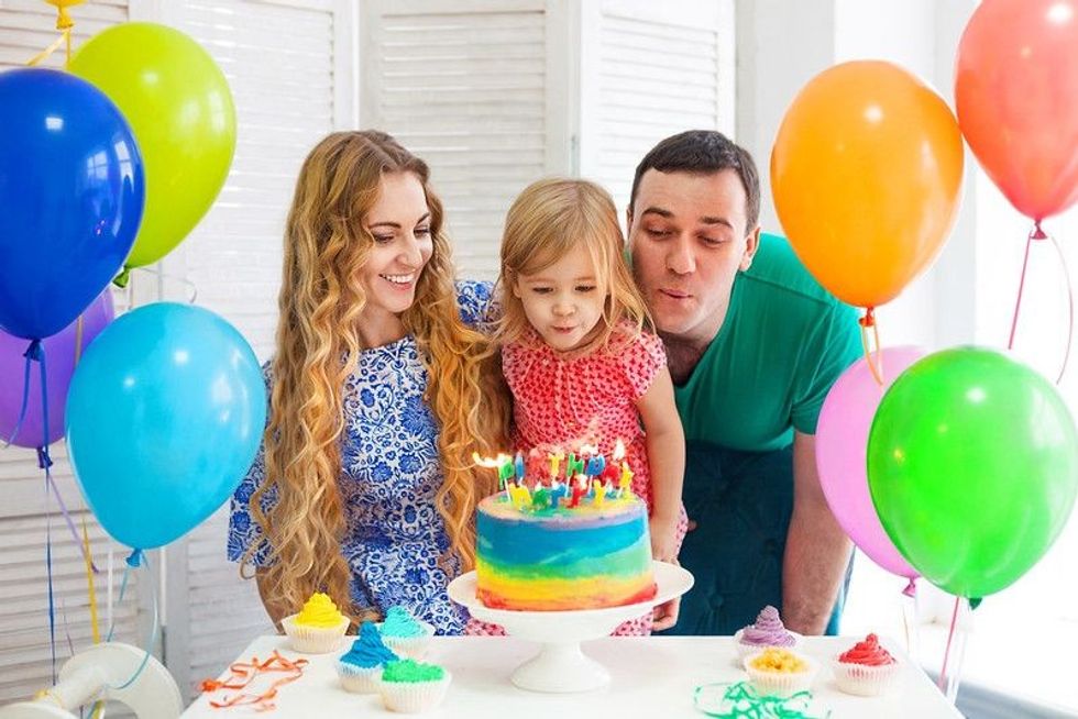 Parents celebrating their daughter's birthday