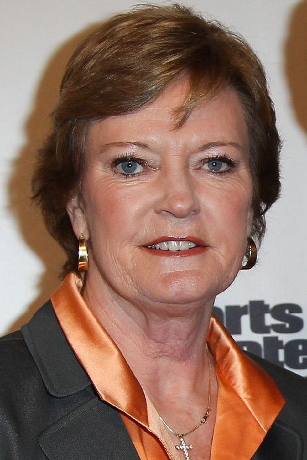 Pat Summitt in a orange shirt