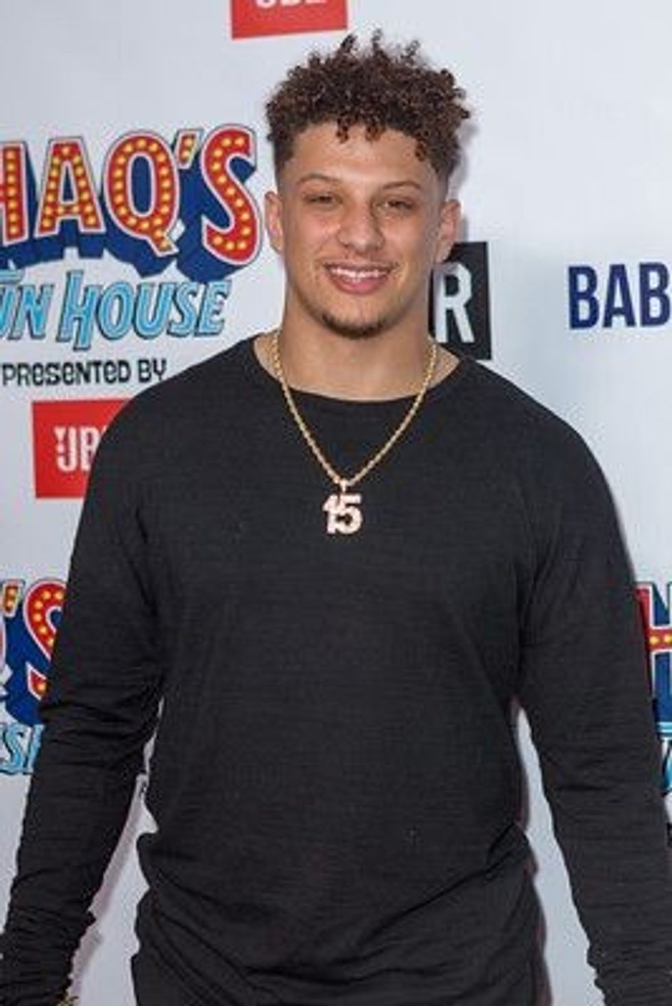 Patrick Mahomes in black t-shirt. 