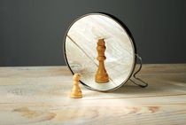 Pawn looking at it's better version in the mirror