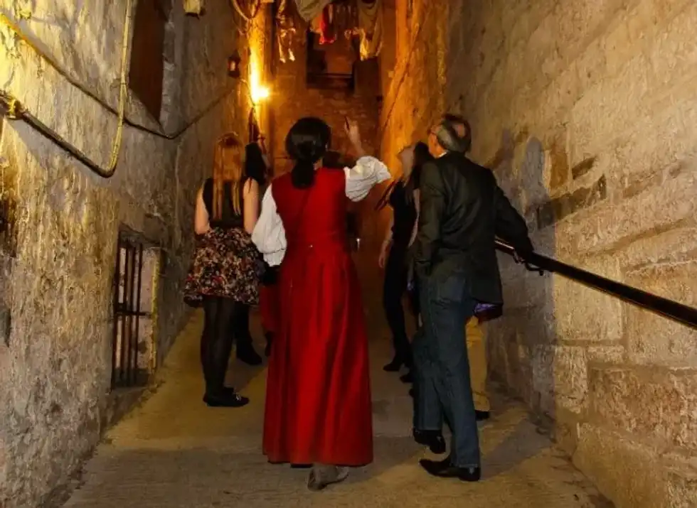 People walking through 17th century streets at The Real Mary King's Close.