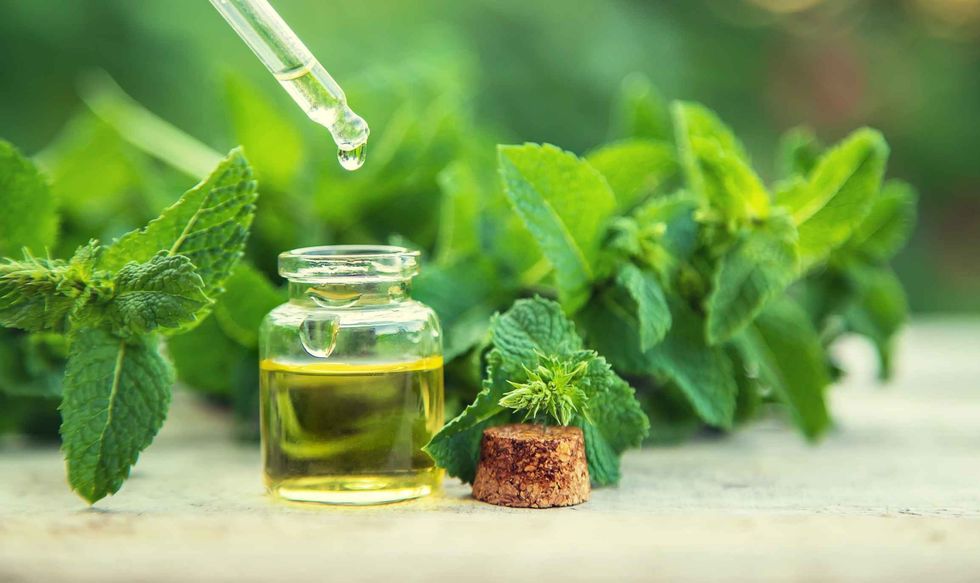 Peppermint essential oil in a small bottle