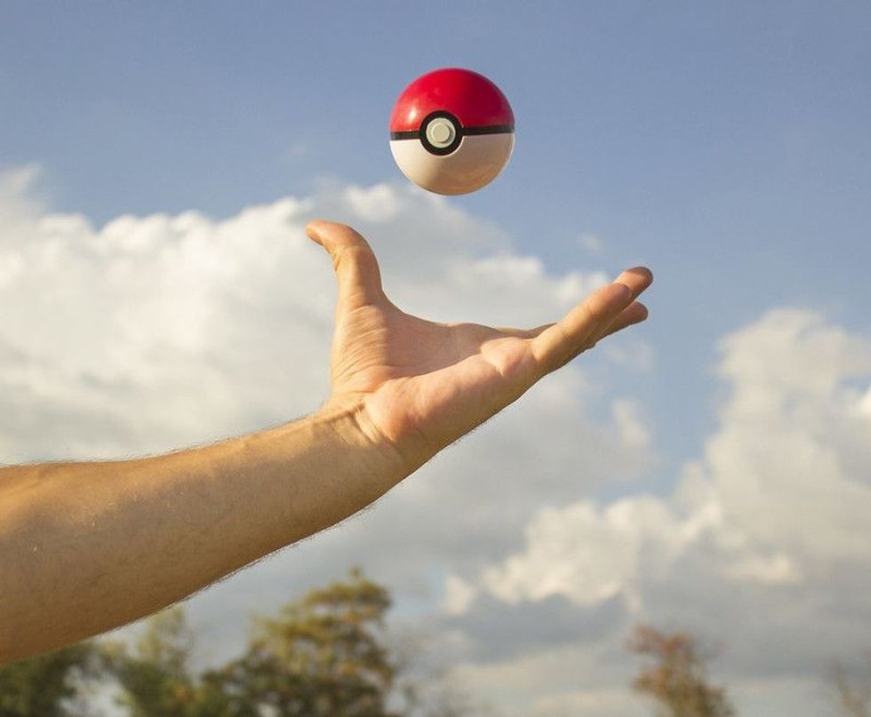 Person catching pokeball