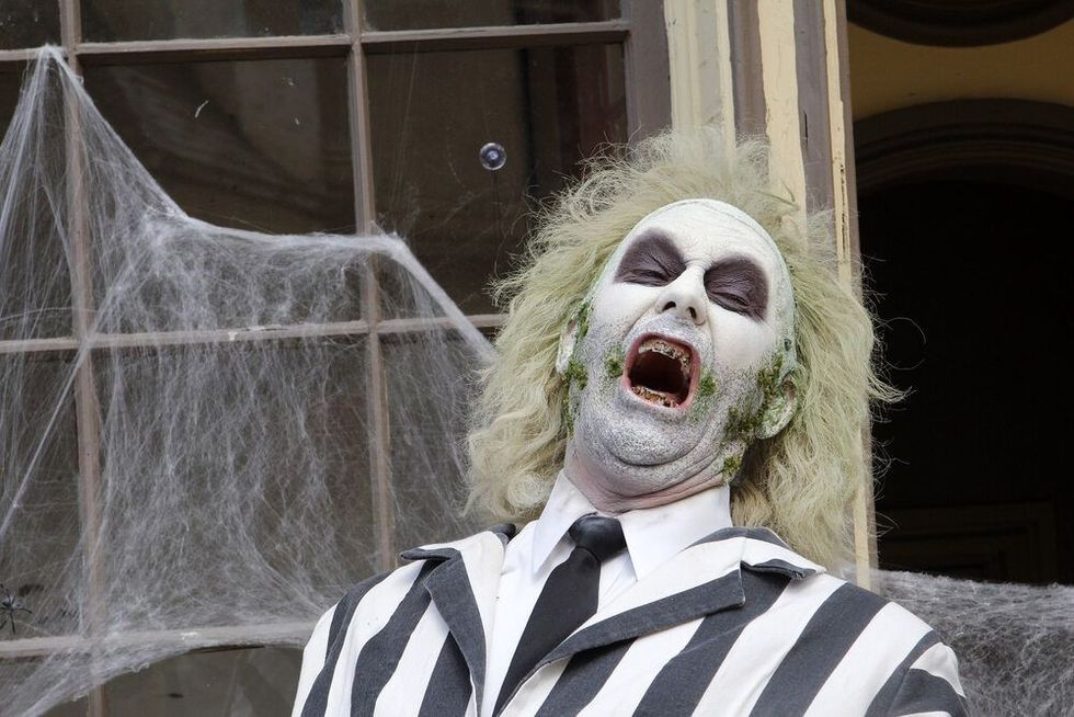 Person wearing a costume of beetlejuice from the 1988 movie beetlejuice